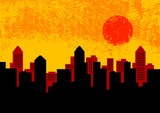 Silhouette of city with orange sky