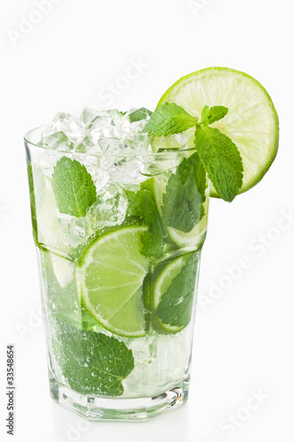 Mojitos cocktail with lime, ice and mint