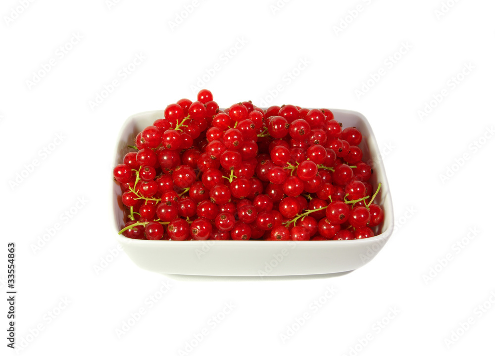 Fresh red currant berry in a plate at white background Fresh red currant berry in a plate at white background