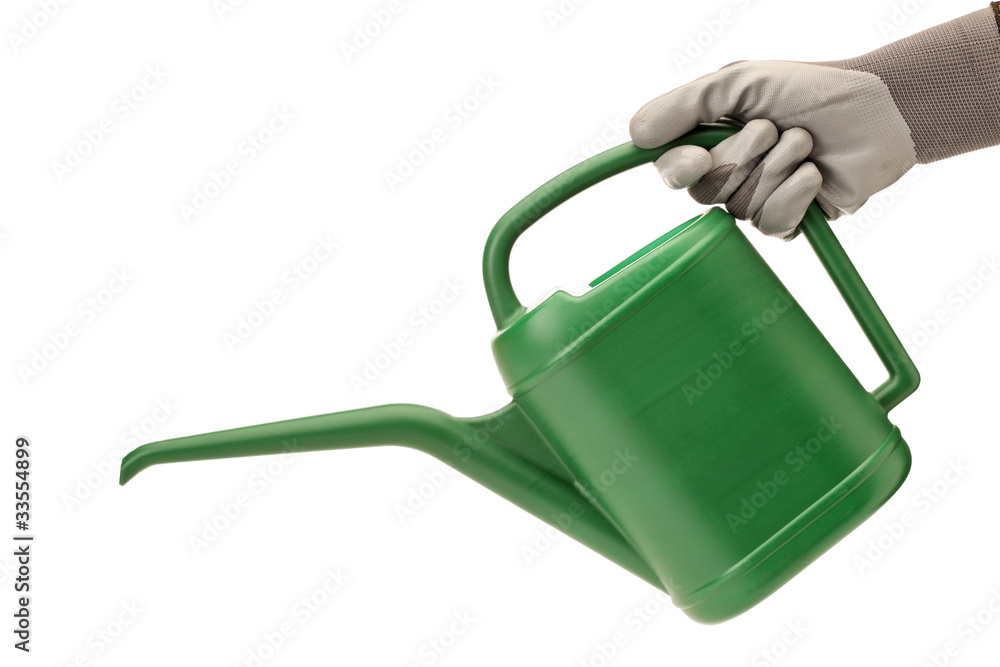 Obraz premium Person with gardening glove holding a watering can