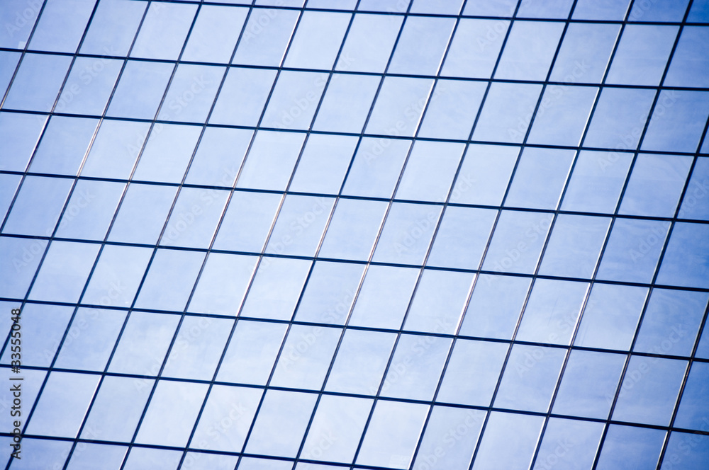 Glass wall with many windows in skyscraper Glass wall with many windows in skyscraper
