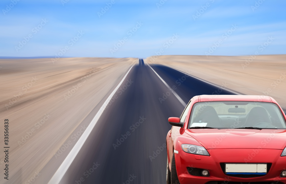 Obraz premium Red car on desert road