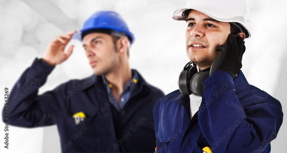 Two engineers in a construction site Two engineers in a construction site