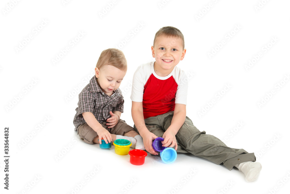 Children play with color toys. isolated, a white background Children play with color toys. isolated, a white background