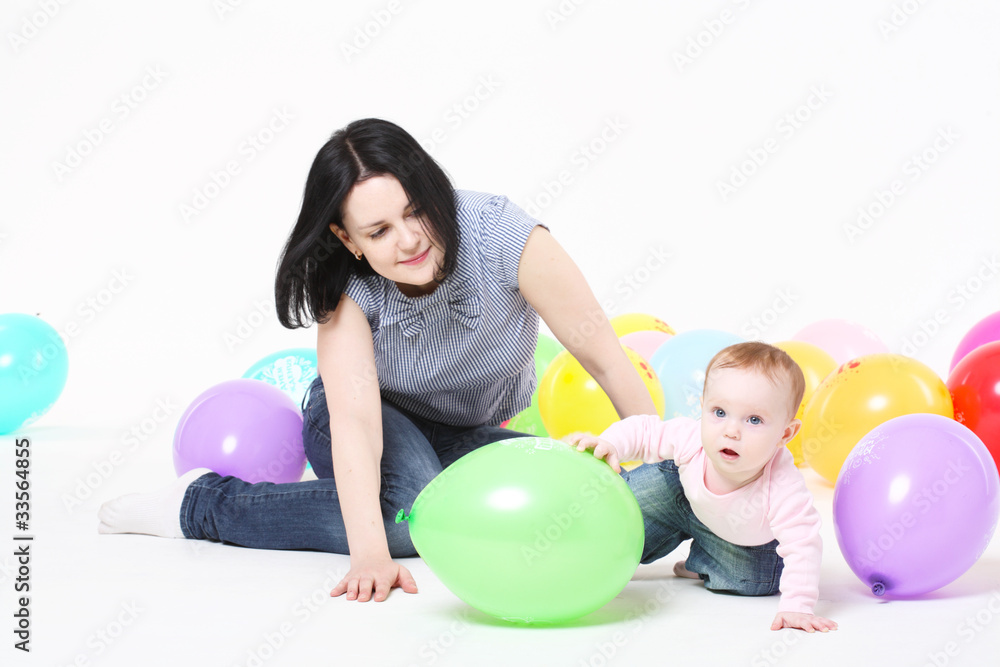 Happy family. Mum embraces the small daughter Happy family. Mum embraces the small daughter