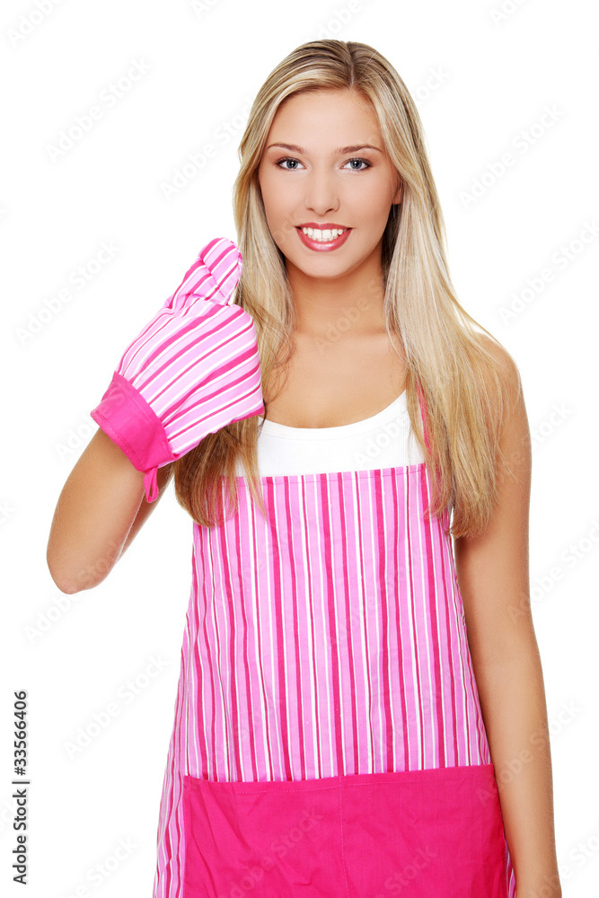 Blond woman wearing kitchen apron Blond woman wearing kitchen apron