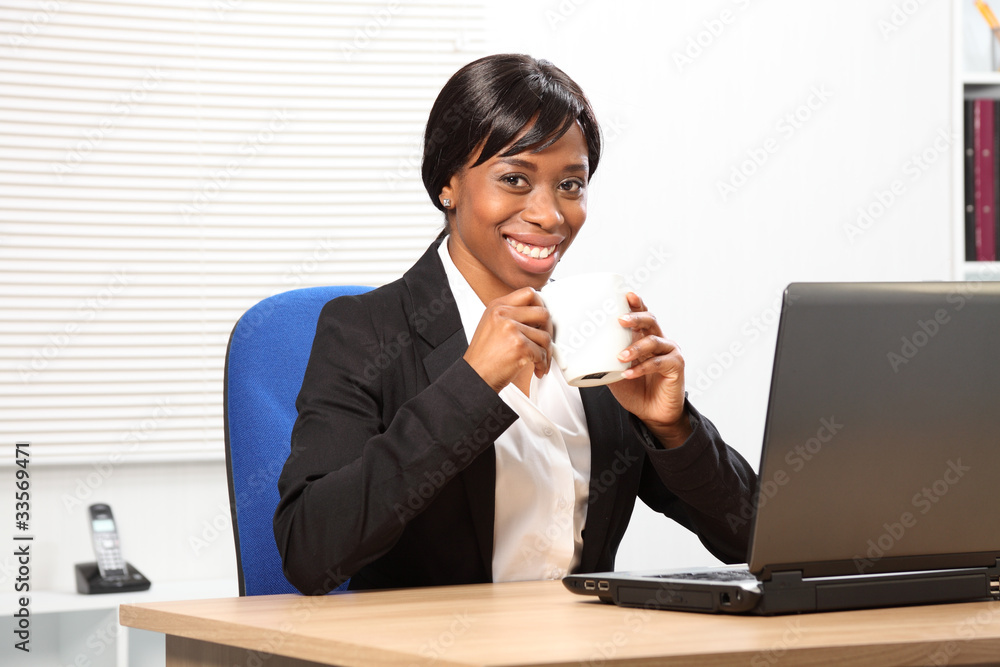 Beautiful black woman drinks coffee at work Beautiful black woman drinks coffee at work