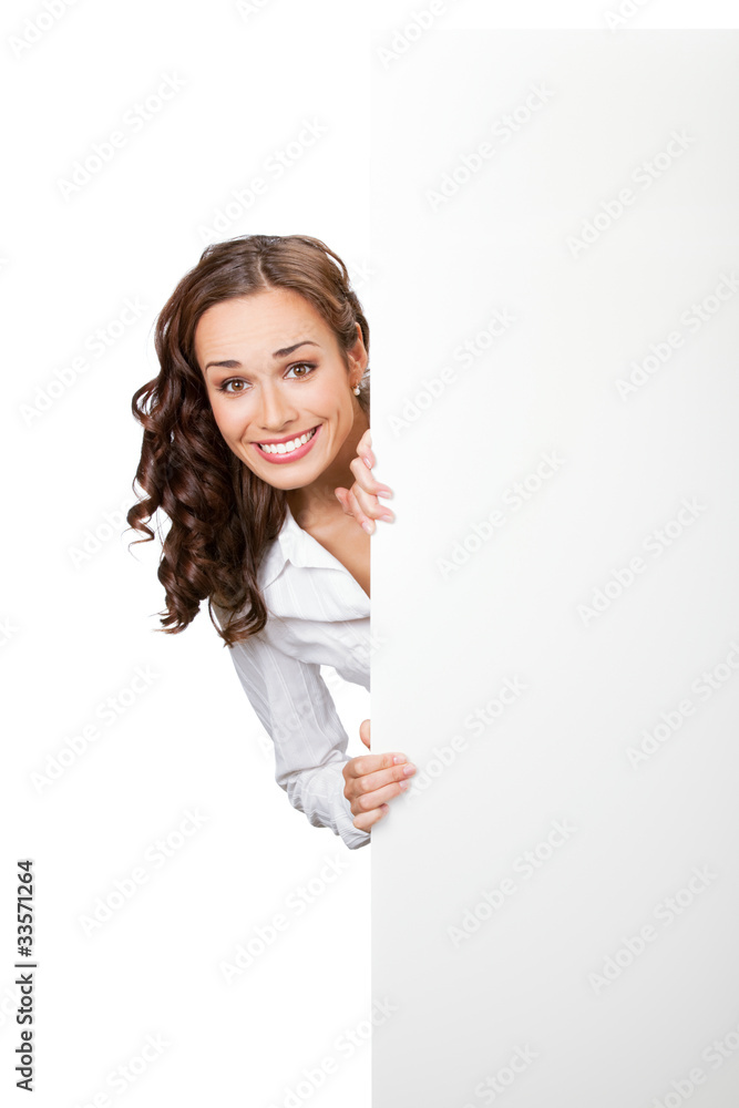 Smiling businesswoman showing blank signboard, isolated Smiling businesswoman showing blank signboard, isolated