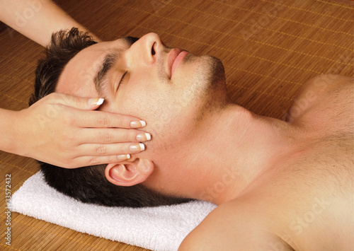 Man getting a face massage #33572432