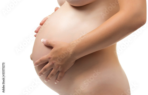 Beautiful pregnant belly in the hands of woman