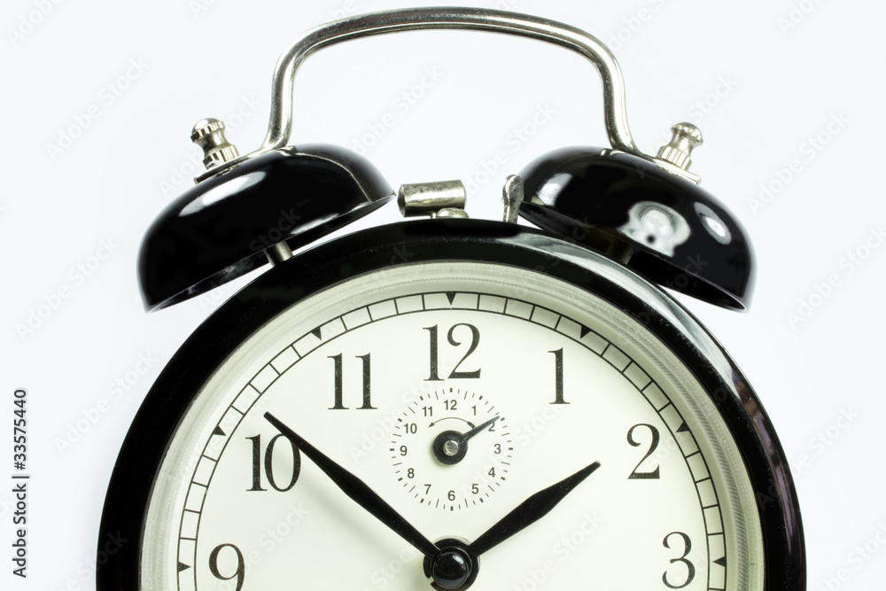 front view of an antique clock on a white background black front view of an antique clock on a white background black