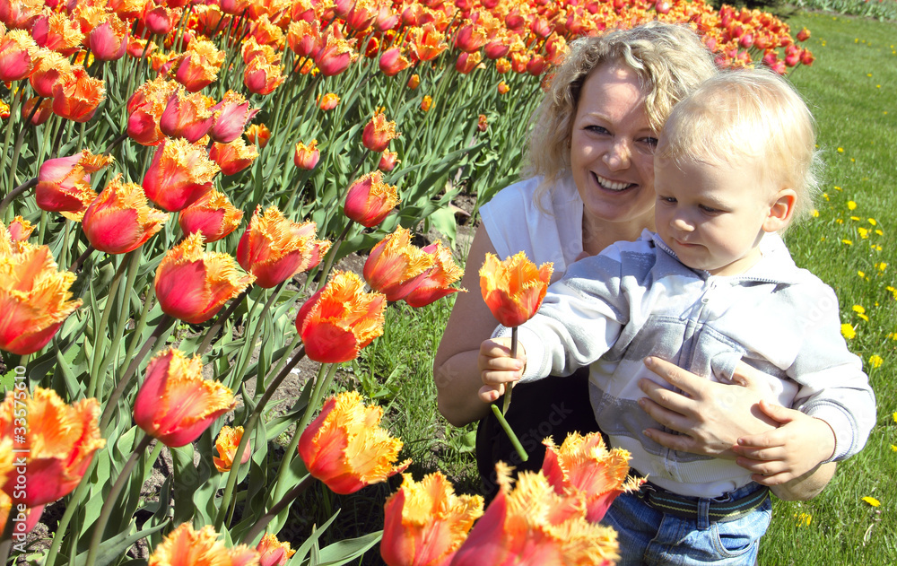 mother and child picking a flower mother and child picking a flower
