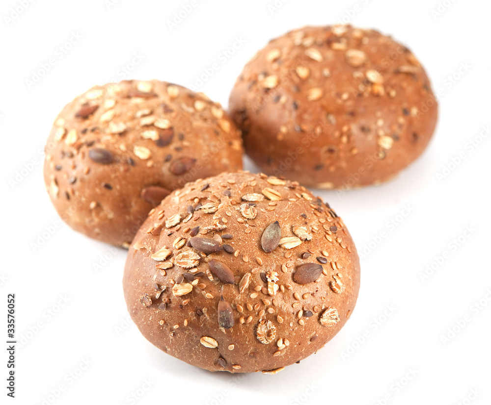 Bread. Seeds buns on the white Bread. Seeds buns on the white