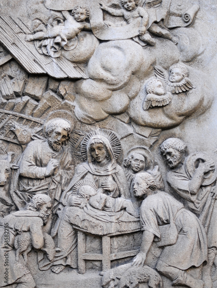 Holy Family, carved in stone on the monument