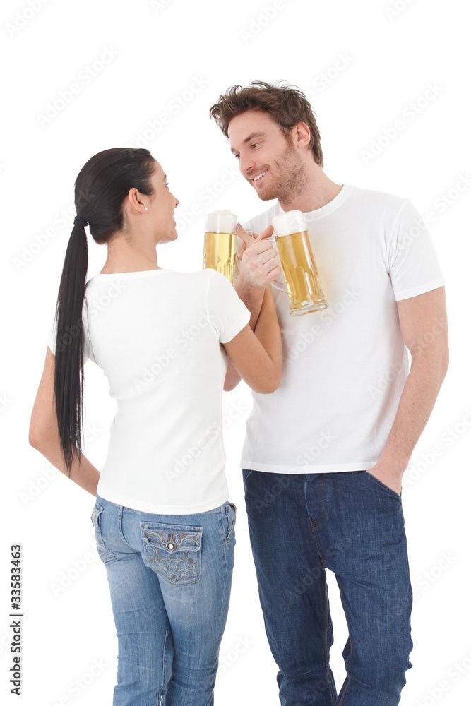Young couple drinking beer having fun smiling Young couple drinking beer having fun smiling