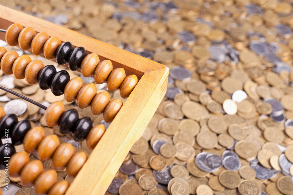Accounting abacus and heap of coins Accounting abacus and heap of coins