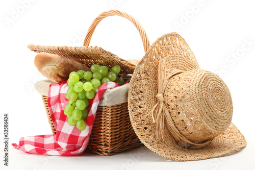 Picnic basket and straw hat