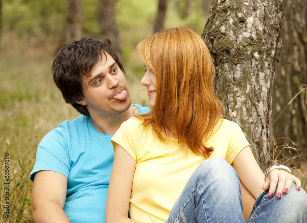 Couple at the park in summer day. Couple at the park in summer day.