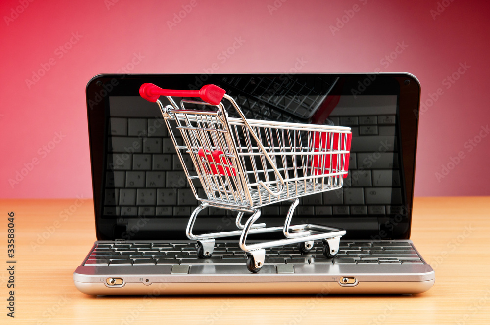 Internet online shopping concept with computer and cart