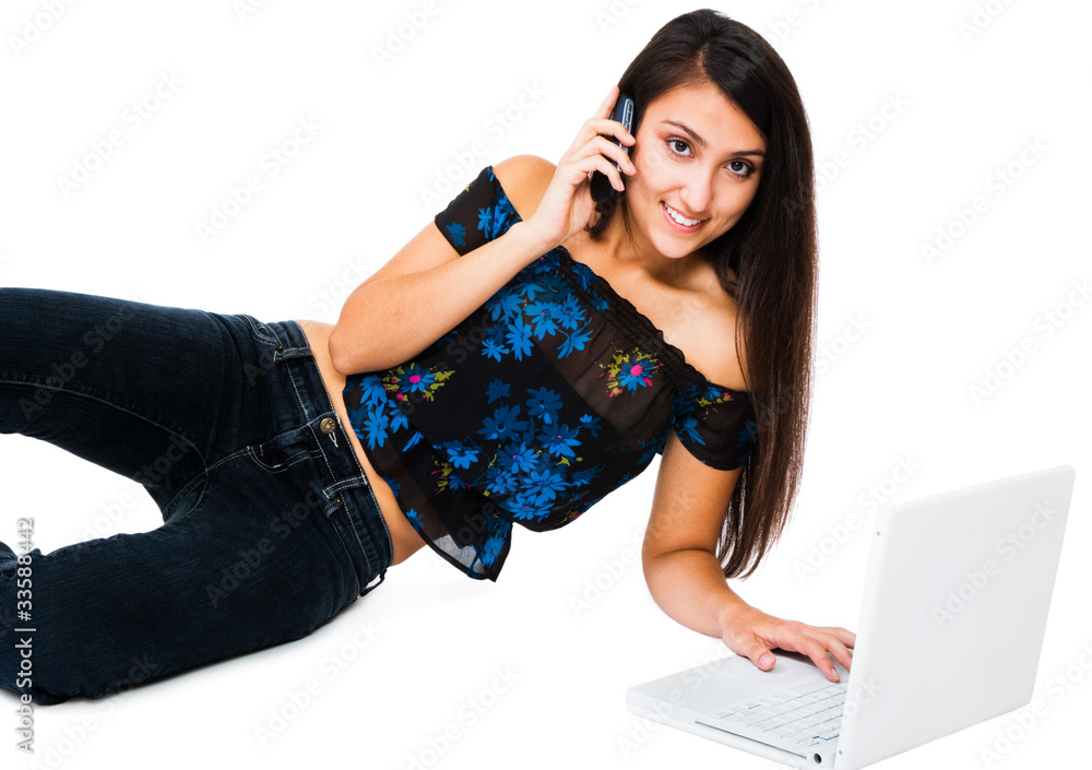 Middle Eastern girl using a laptop and mobile Middle Eastern girl using a laptop and mobile