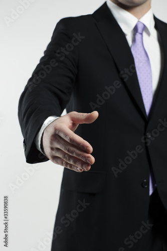 businessman extending hand for a handshake