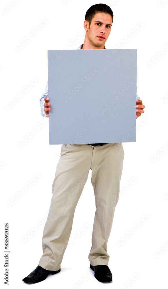 Young man showing placard Young man showing placard
