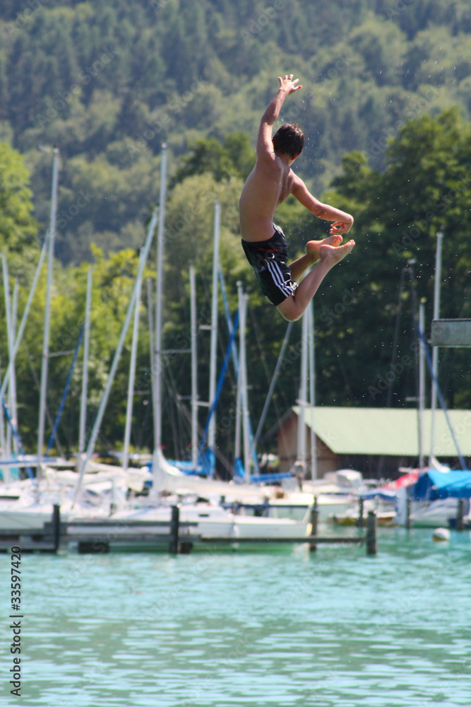 Boy Jumping into Water