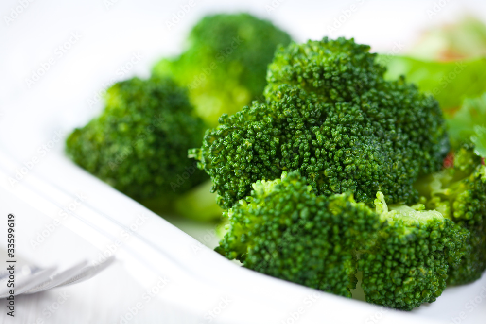 Cooked broccoli on a plate Cooked broccoli on a plate