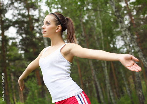 Fototapeta Naklejka Na Ścianę i Meble -  Young woman doing sport outdoors