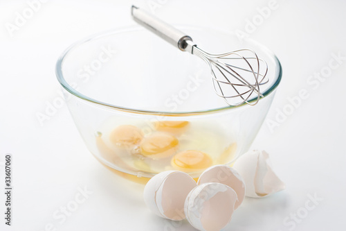 Whisk with eggs in a bowl