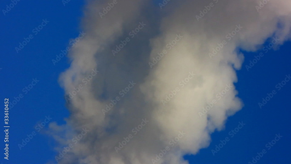 Smoke from a pipe on a background of the light-blue sky. Smoke from a pipe on a background of the light-blue sky.