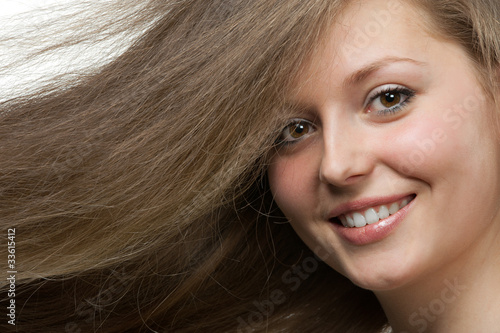 Healthy beautiful long hair closeup in motion created by wind