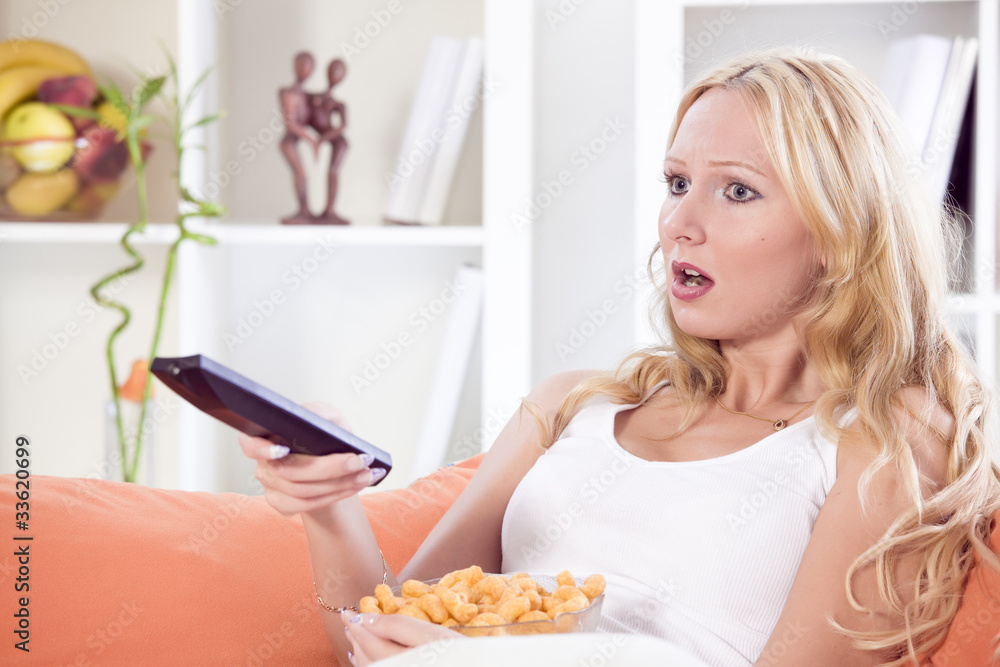 shocked woman with remote control