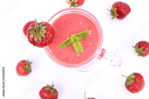 Fototapeta Naklejka Na Ścianę i Meble -  Strawberry shake in a glass with strawberries and mint