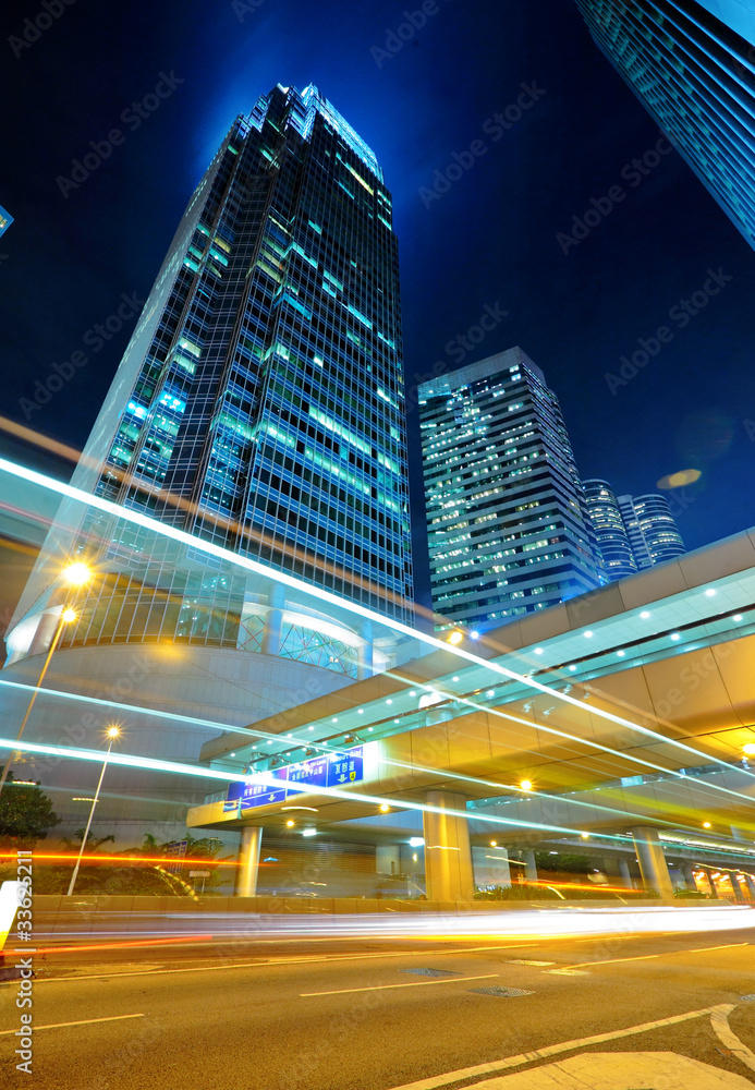 Fototapeta premium light trails on the modern building background
