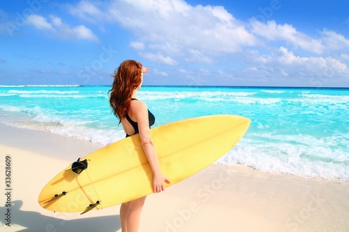 side view surfer woman tropical sea looking waves