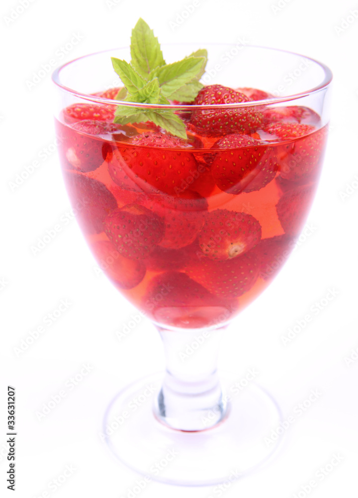 Jelly with strawberries decorated with a mint twig Jelly with strawberries decorated with a mint twig