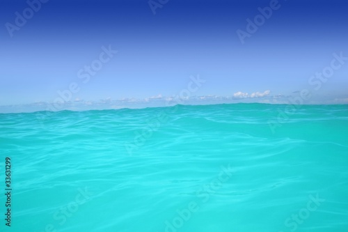caribbean wave turquoise water horizon line and blue sky