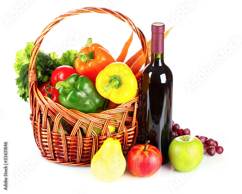 A set of vegetables in wricker basket isolated on white photo