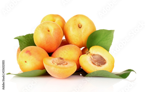 apricots with leaves isolated on white