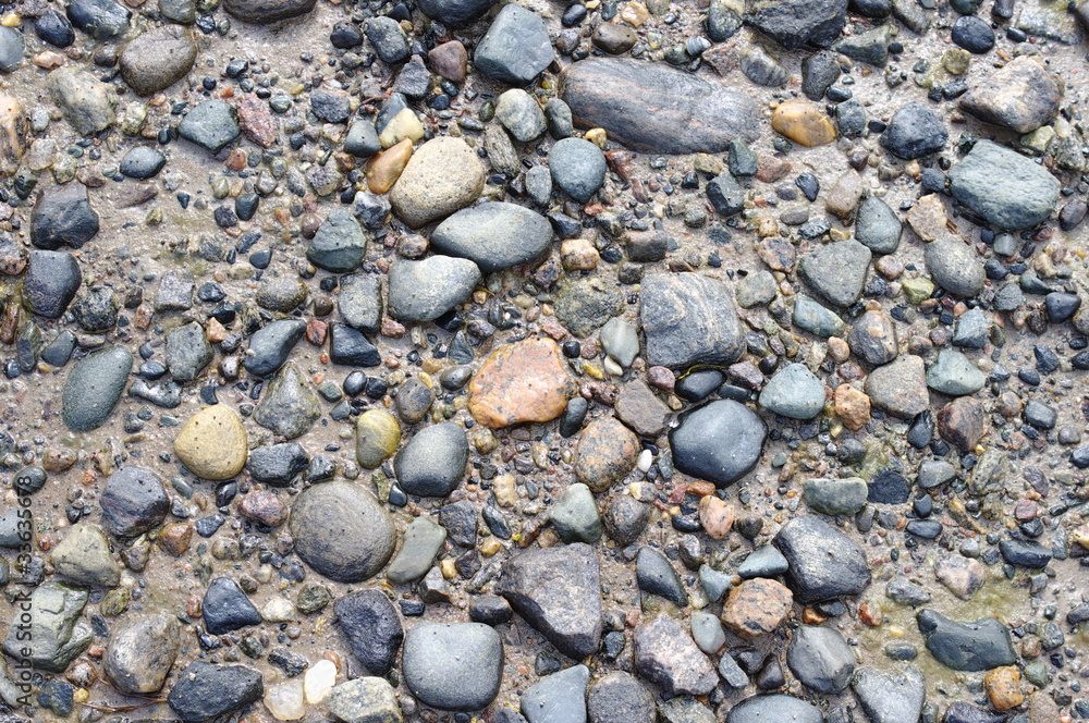 Picture stones on a sea bottom in low-tide water Picture stones on a sea bottom in low-tide water