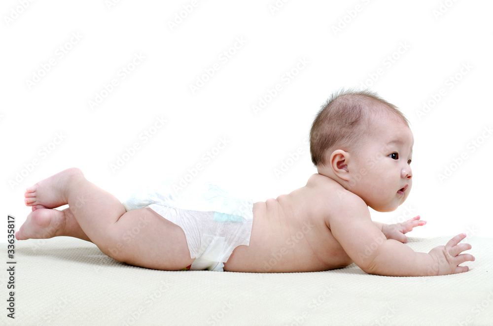 Five months old baby girl happy crawling on bed Five months old baby girl happy crawling on bed