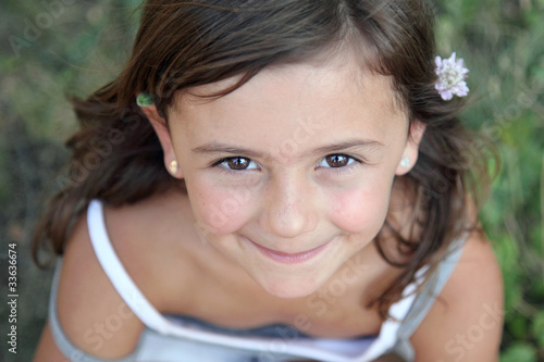 Foto Petit sourire d'une grande malicieuse