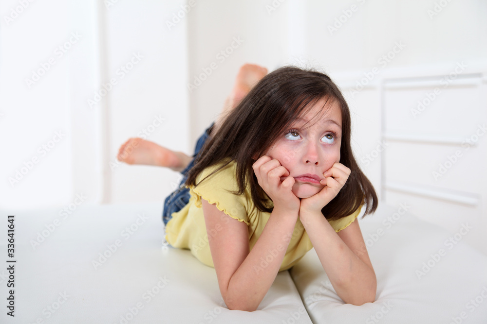 Portrait of little girl with bored expression Portrait of little girl with bored expression