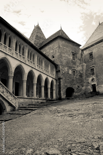 Black and white image of an old castle courtyard #33642410