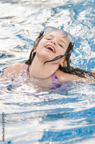 picture of a young girl playing in a pool