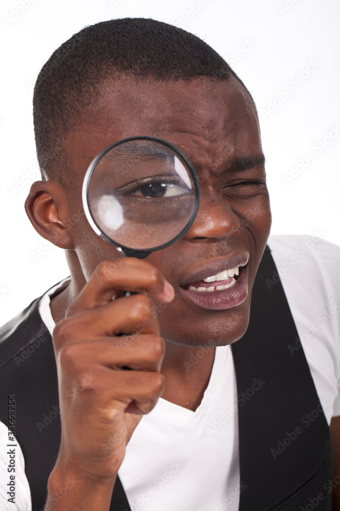 man holding a magnifying glass man holding a magnifying glass