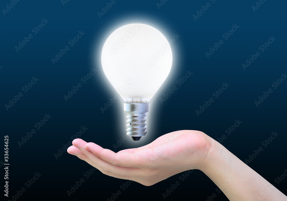 light bulb in women hand on dark light bulb in women hand on dark