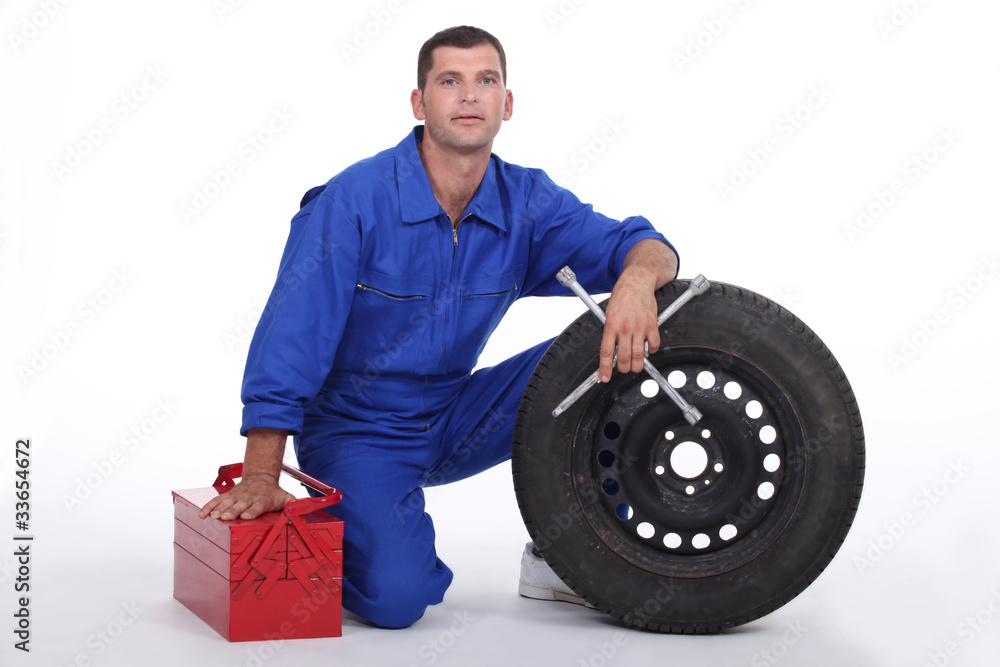 mechanic changing a tire