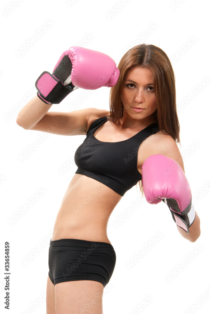 Beautiful young woman boxing pose in Pink gloves Beautiful young woman boxing pose in Pink gloves